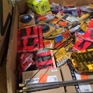 Mixed power tools and boxed hardware merchandise in a wholesale warehouse pallet bin