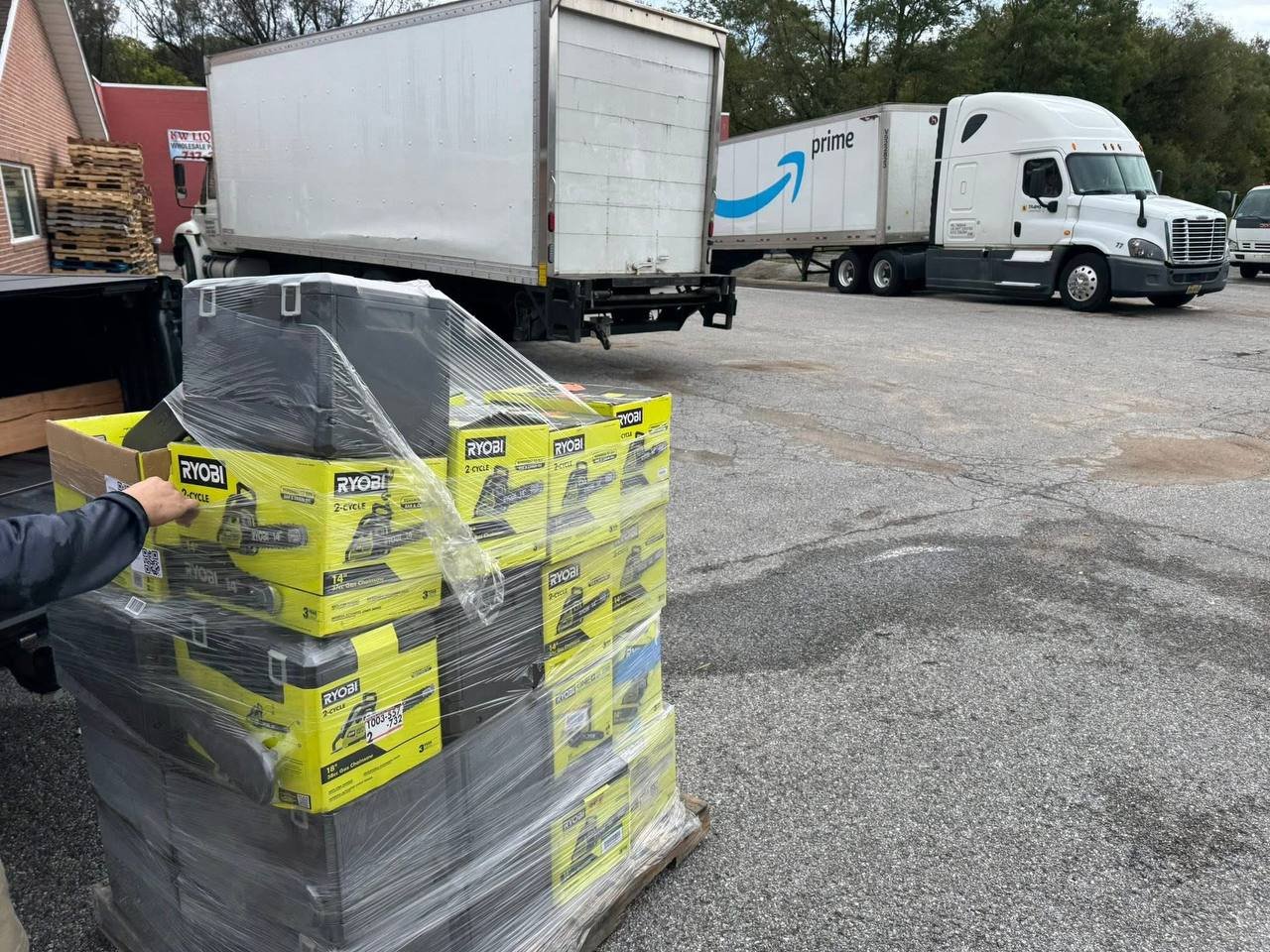 Palletized merchandise being loaded for transport
