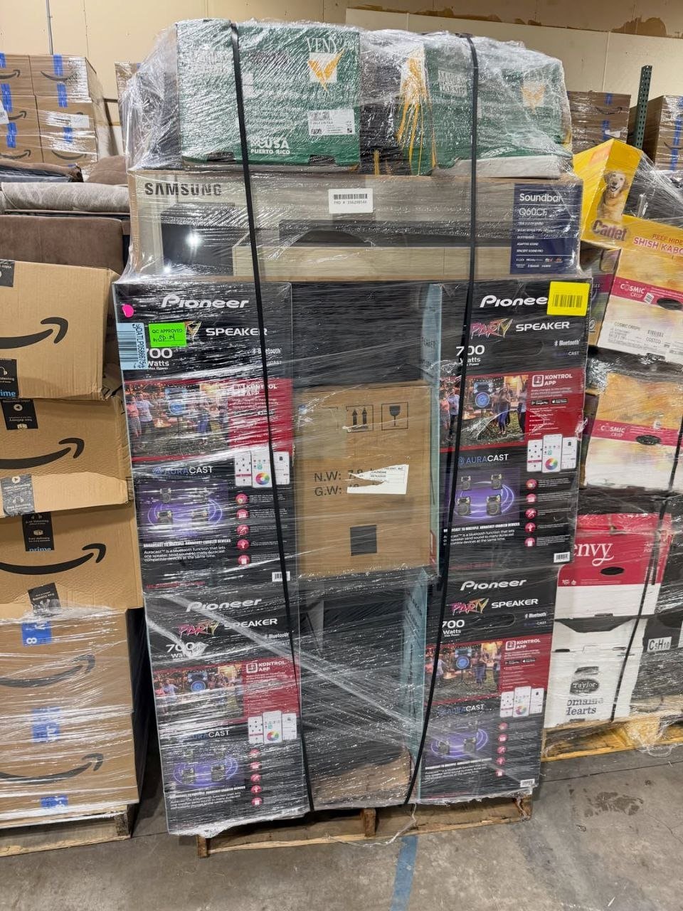 Mixed merchandise liquidation pallet with boxed retail goods and electronics