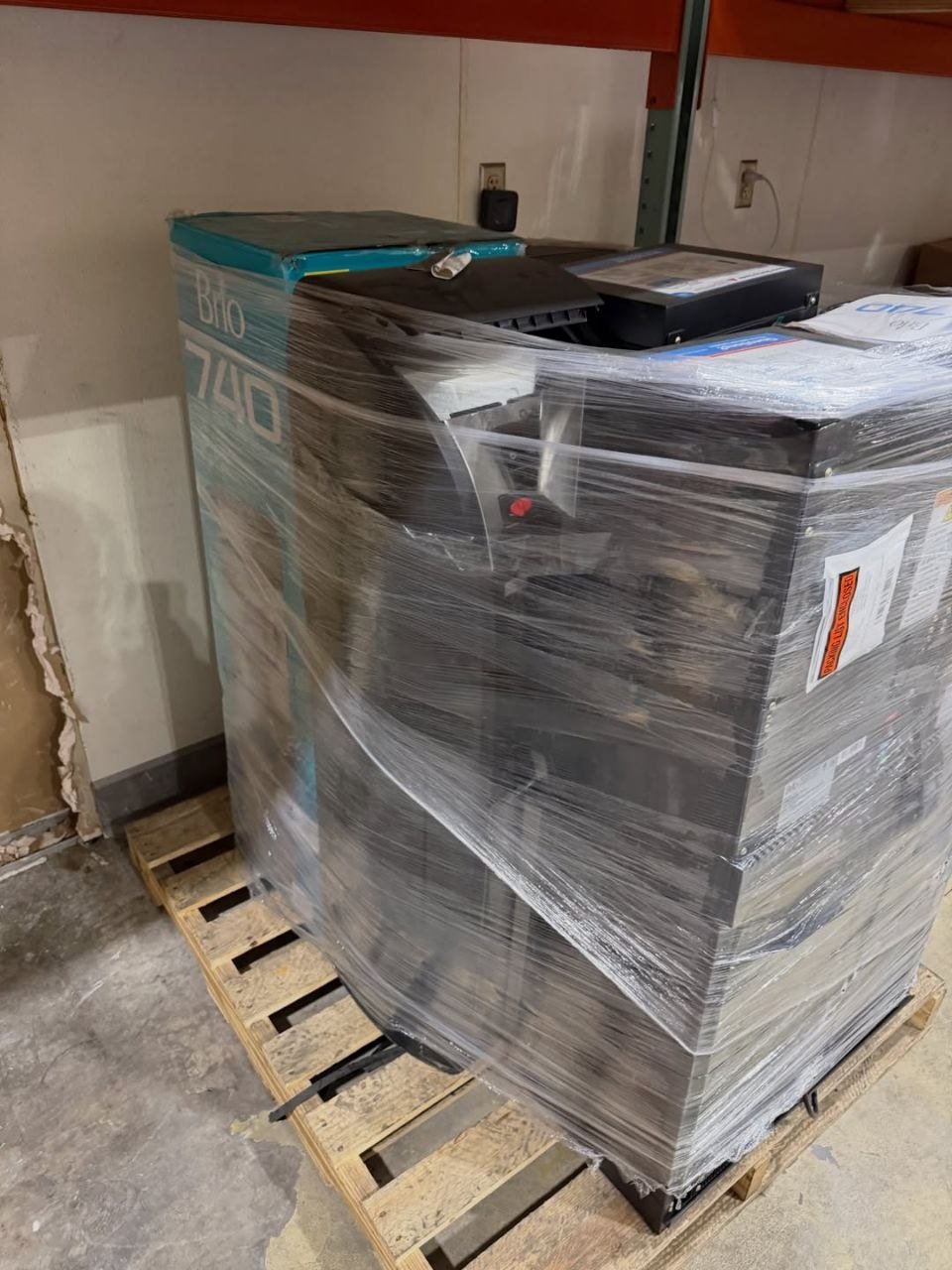 Wrapped liquidation pallet with assorted appliances and boxed merchandise