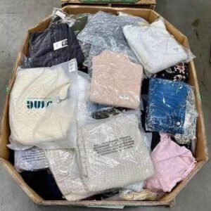 Overhead view of bulk women's winter clothing pallet containing assorted sweaters and apparel