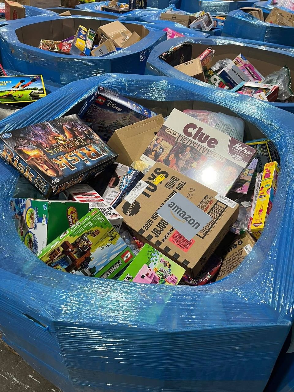 Bulk toy liquidation pallet with LEGO Minecraft toys and Clue board game