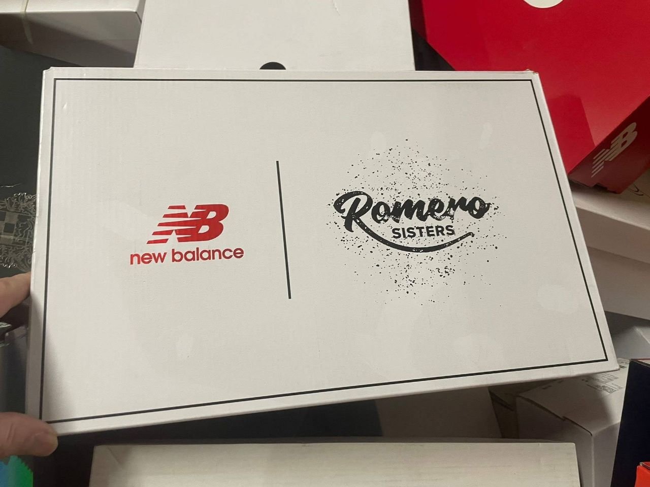 New Balance and Romero Sisters footwear packaging close up