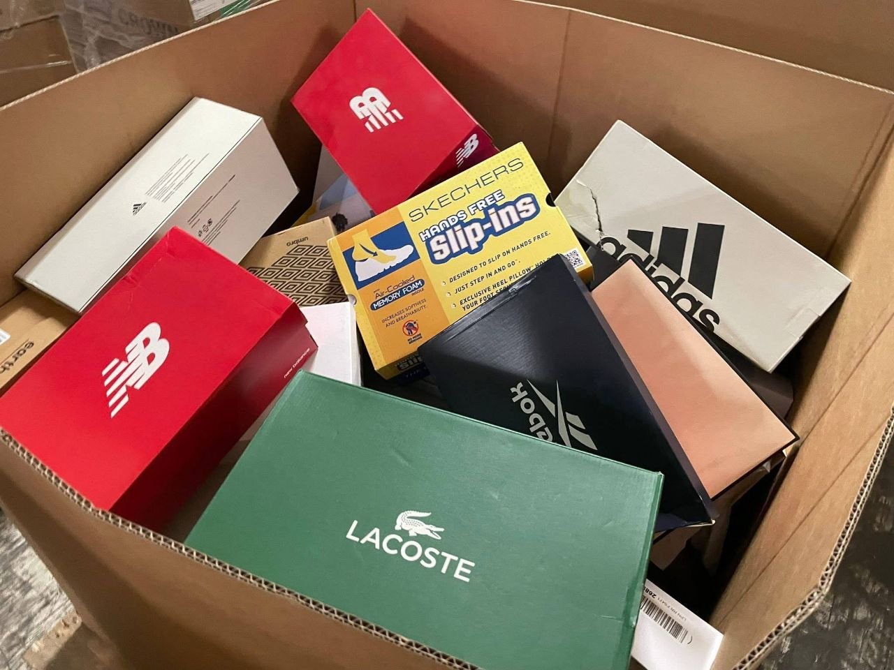Wholesale shoe assortment including boxed Lacoste Skechers adidas and New Balance items