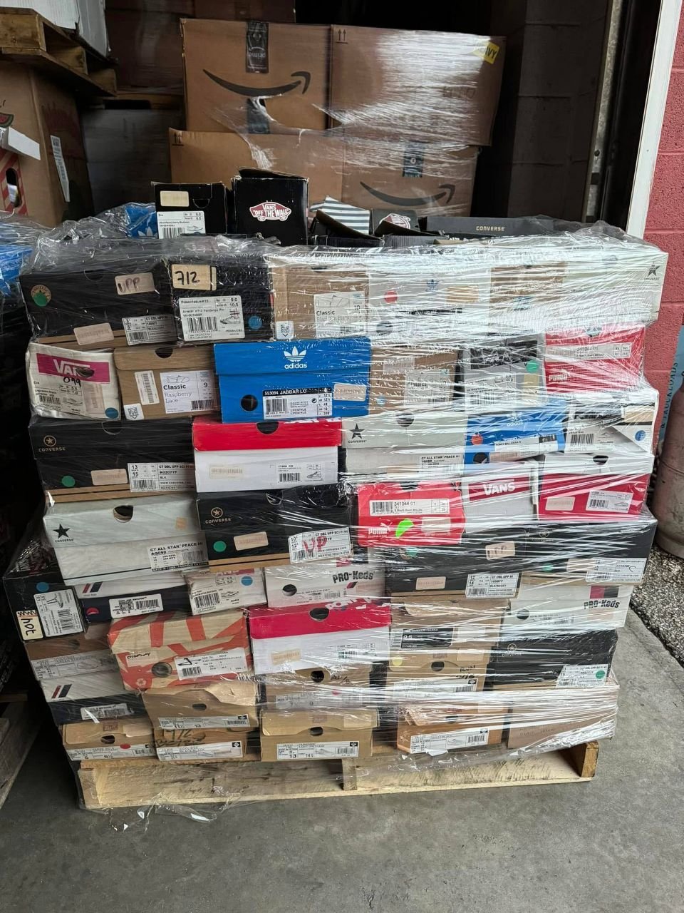 Wholesale pallet of boxed branded shoes including Vans Converse Puma and adidas