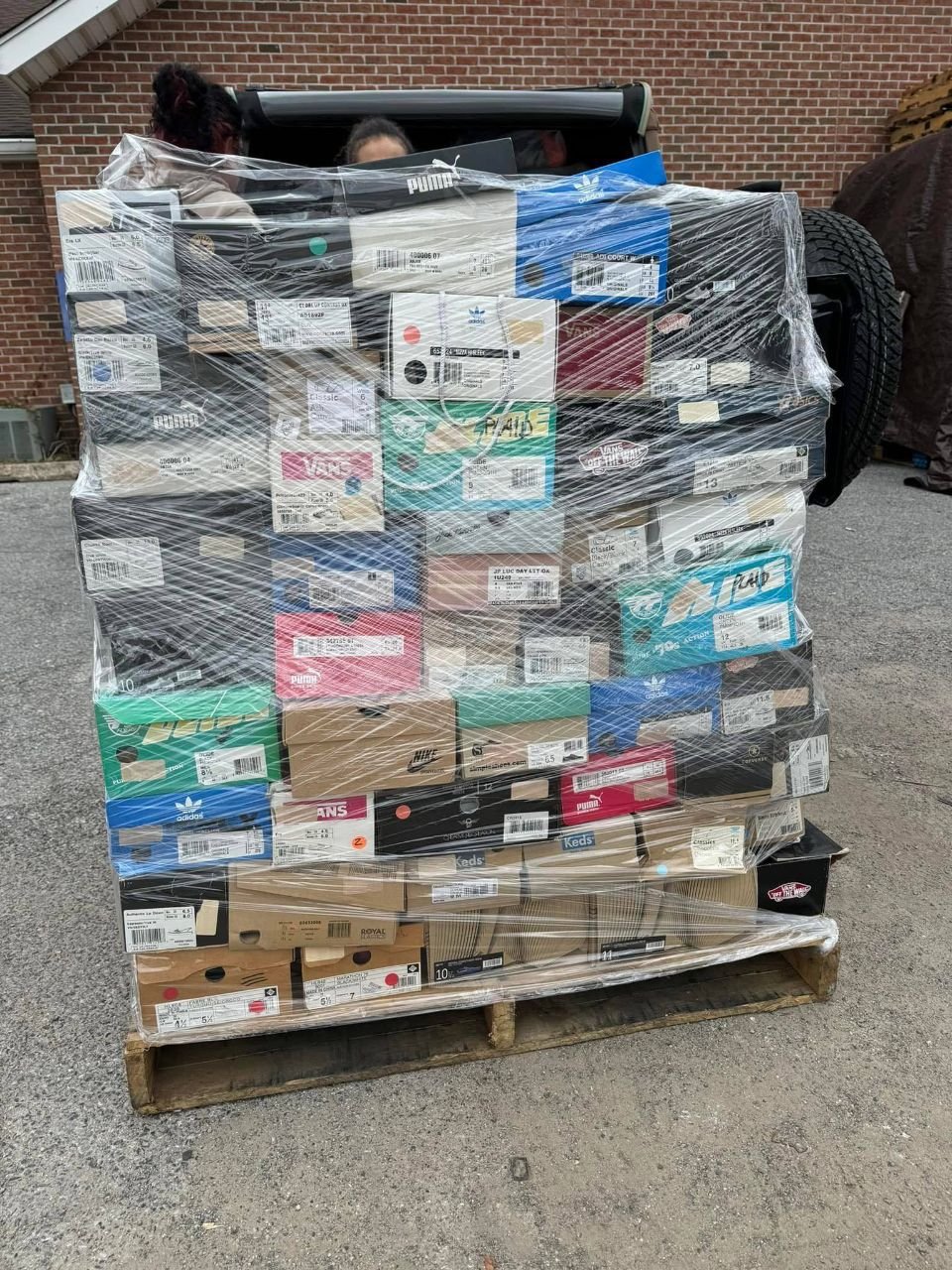 Wrapped mixed branded footwear pallet with assorted boxed shoes