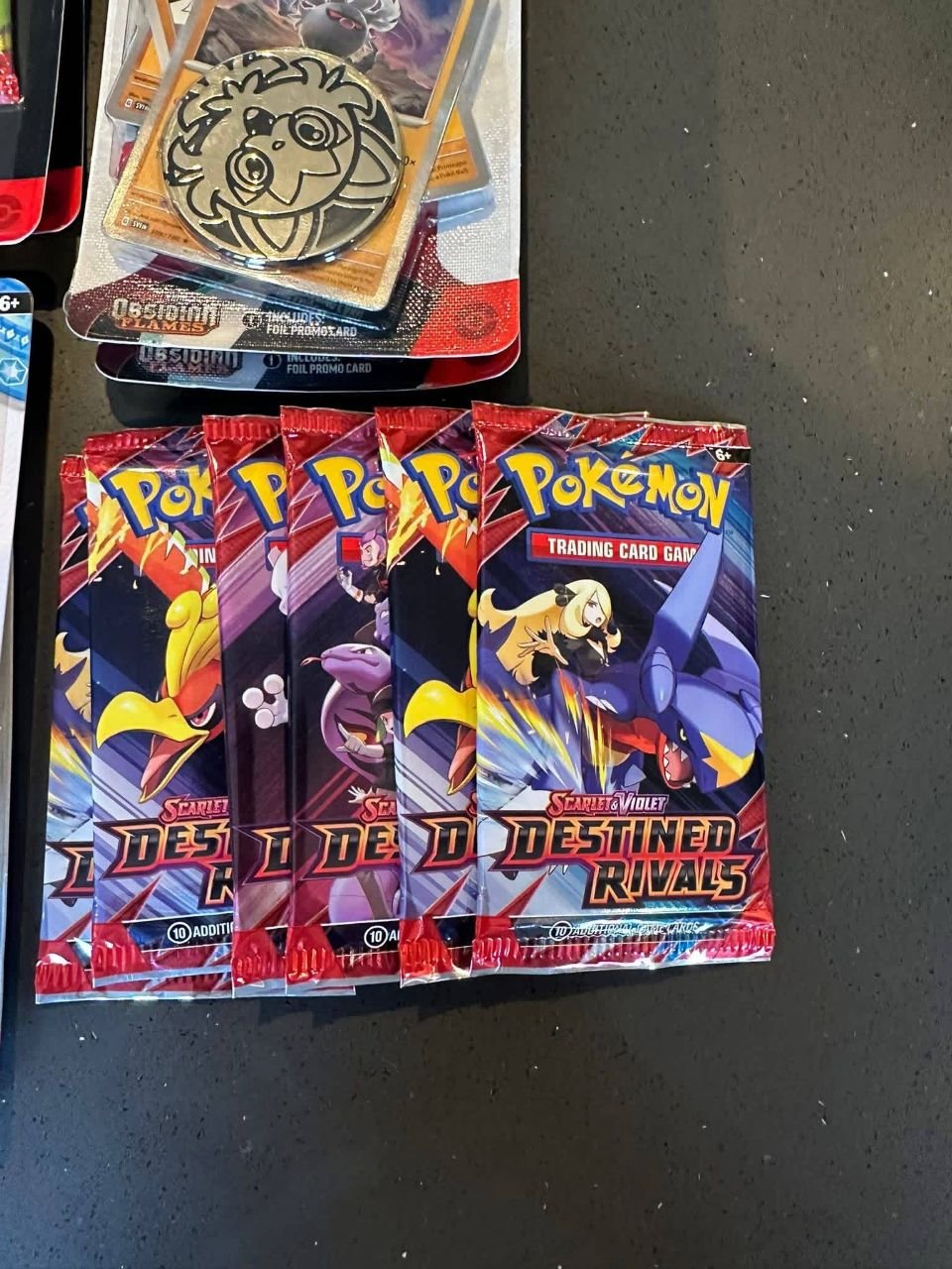 Pokémon TCG Destined Rivals booster packs and foil promo coin pack