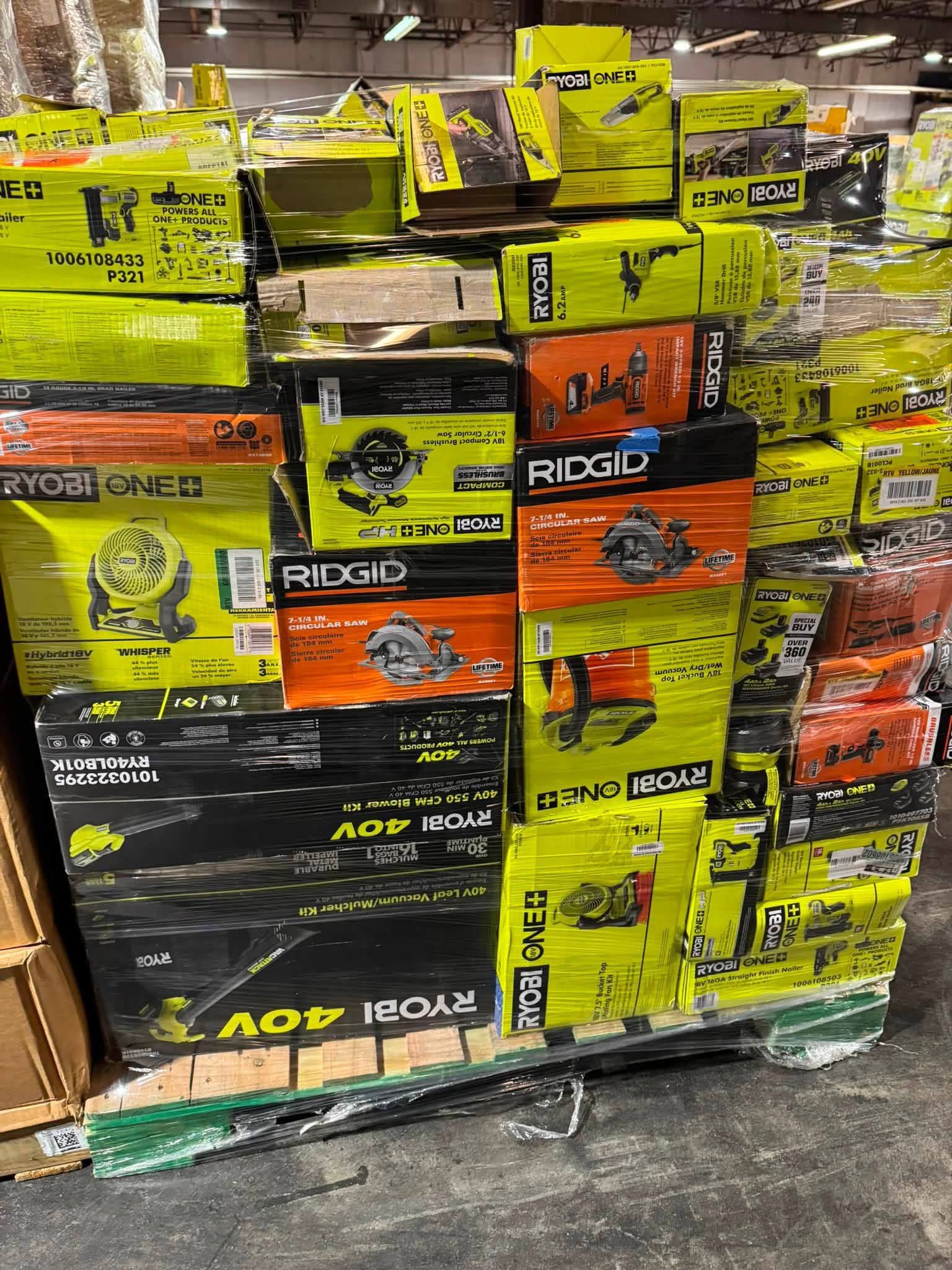 Warehouse pallet of assorted RYOBI and RIDGID boxed power tools and circular saws