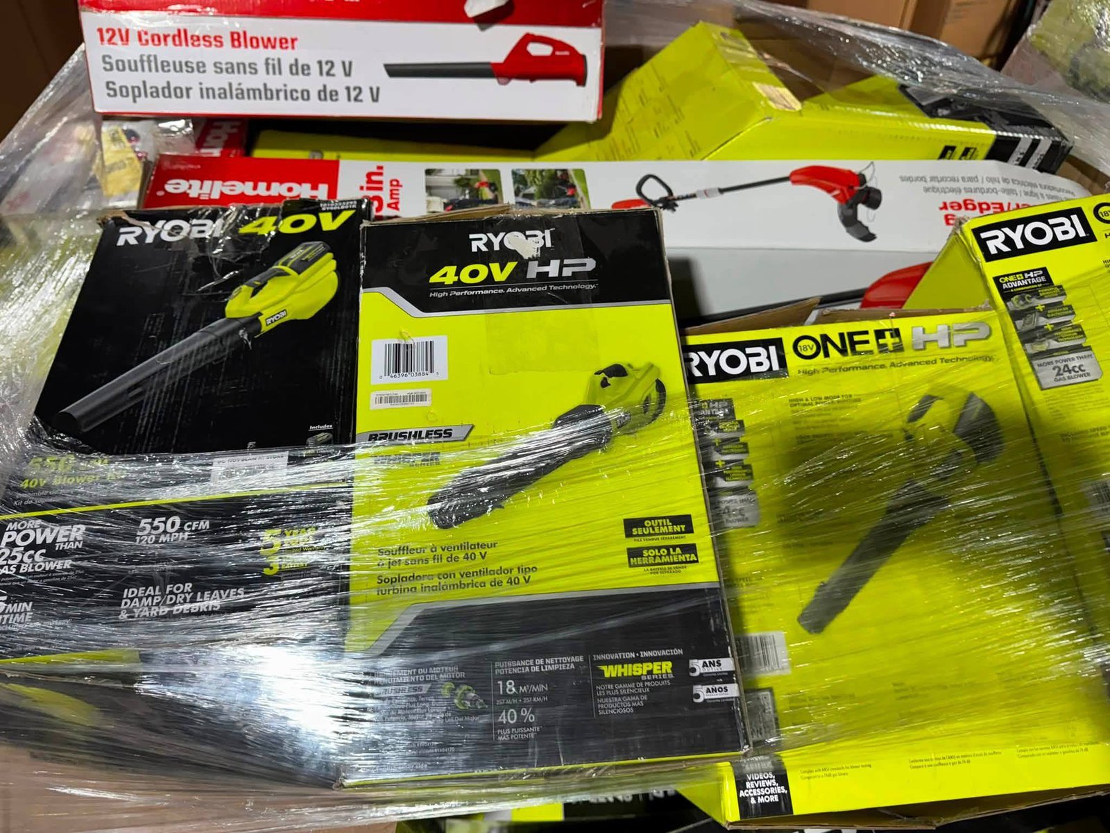 Close-up of RYOBI 40V brushless blowers and RYOBI ONE+ HP tools on pallet