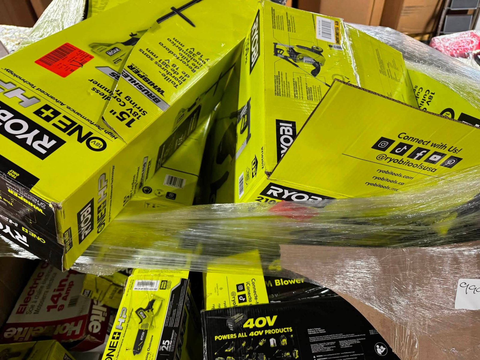 Bulk boxed RYOBI power tool equipment and batteries in pallet stock