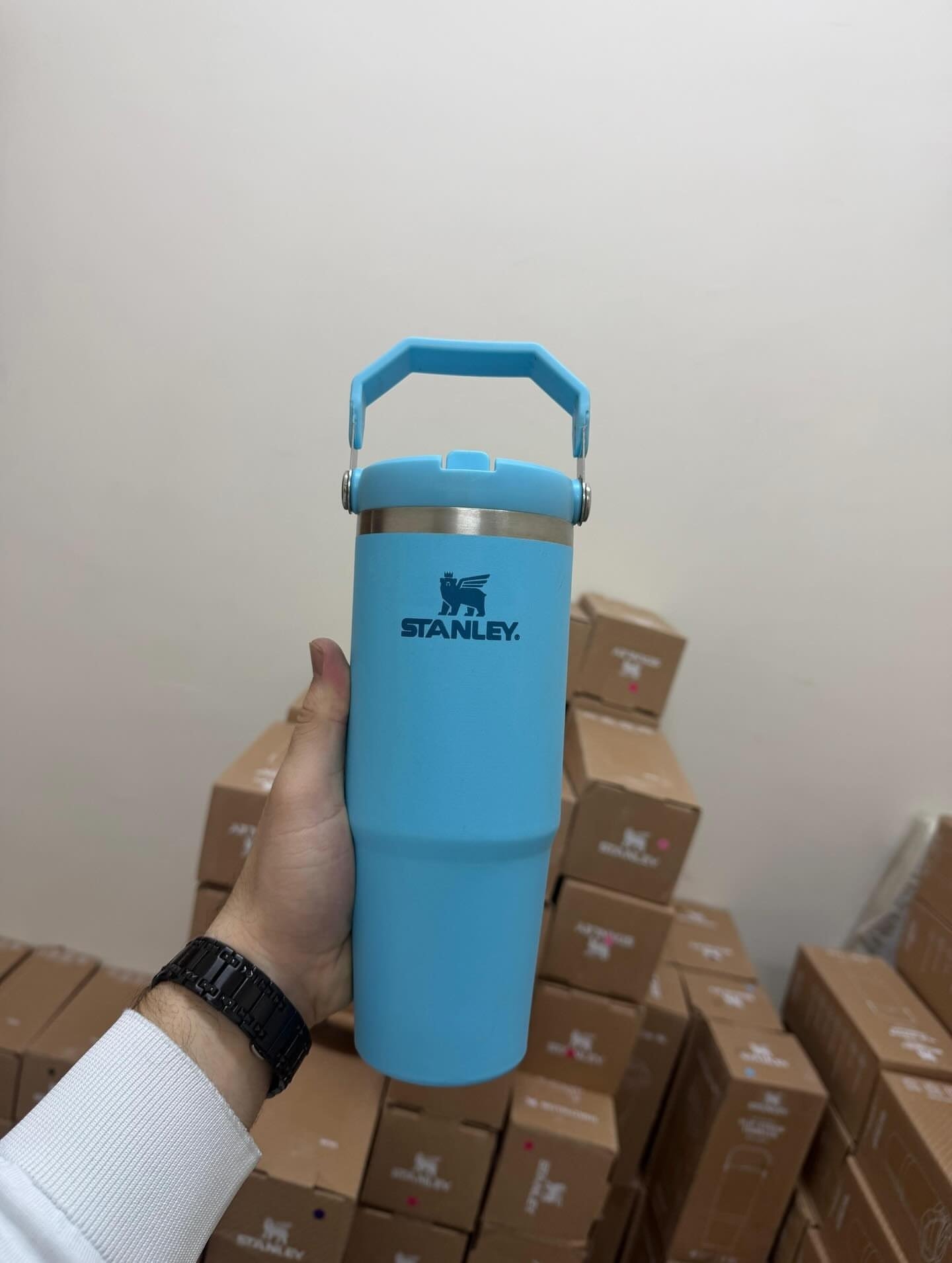 Light blue Stanley 30oz handled Quencher tumbler photographed in cup warehouse
