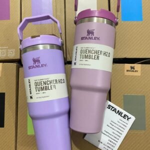 Two purple Stanley Quencher H2.0 30 oz tumblers standing on stacked wholesale cup boxes