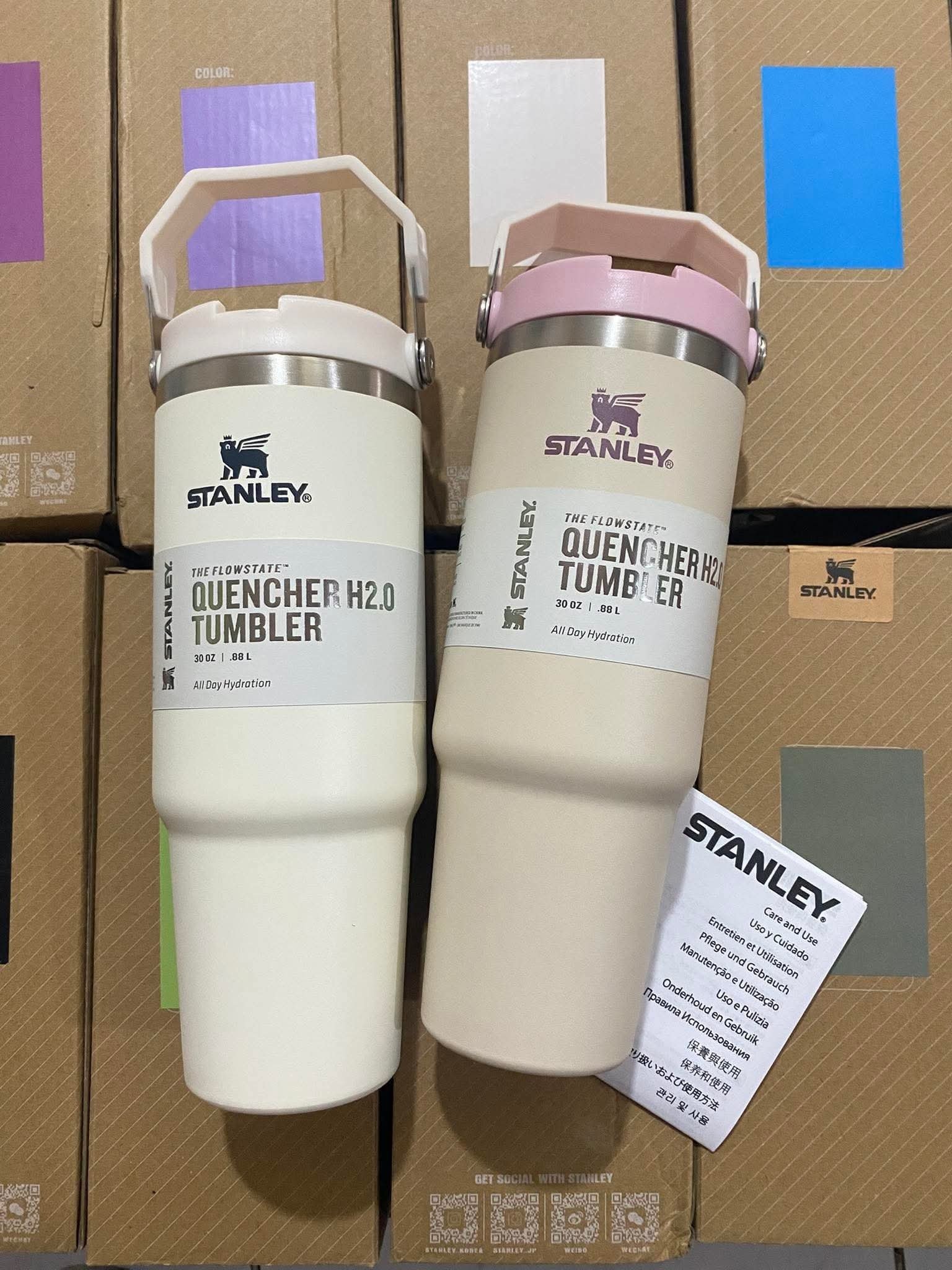 White and pink Stanley Quencher H2.0 30 oz handled tumblers in mixed wholesale cup stock