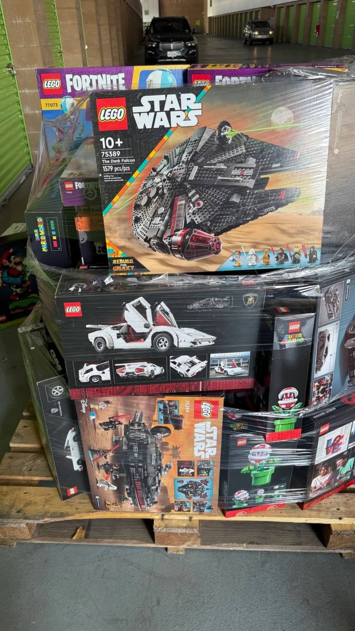 LEGO construction toy pallets with boxed LEGO Fortnite Star Wars and other building sets