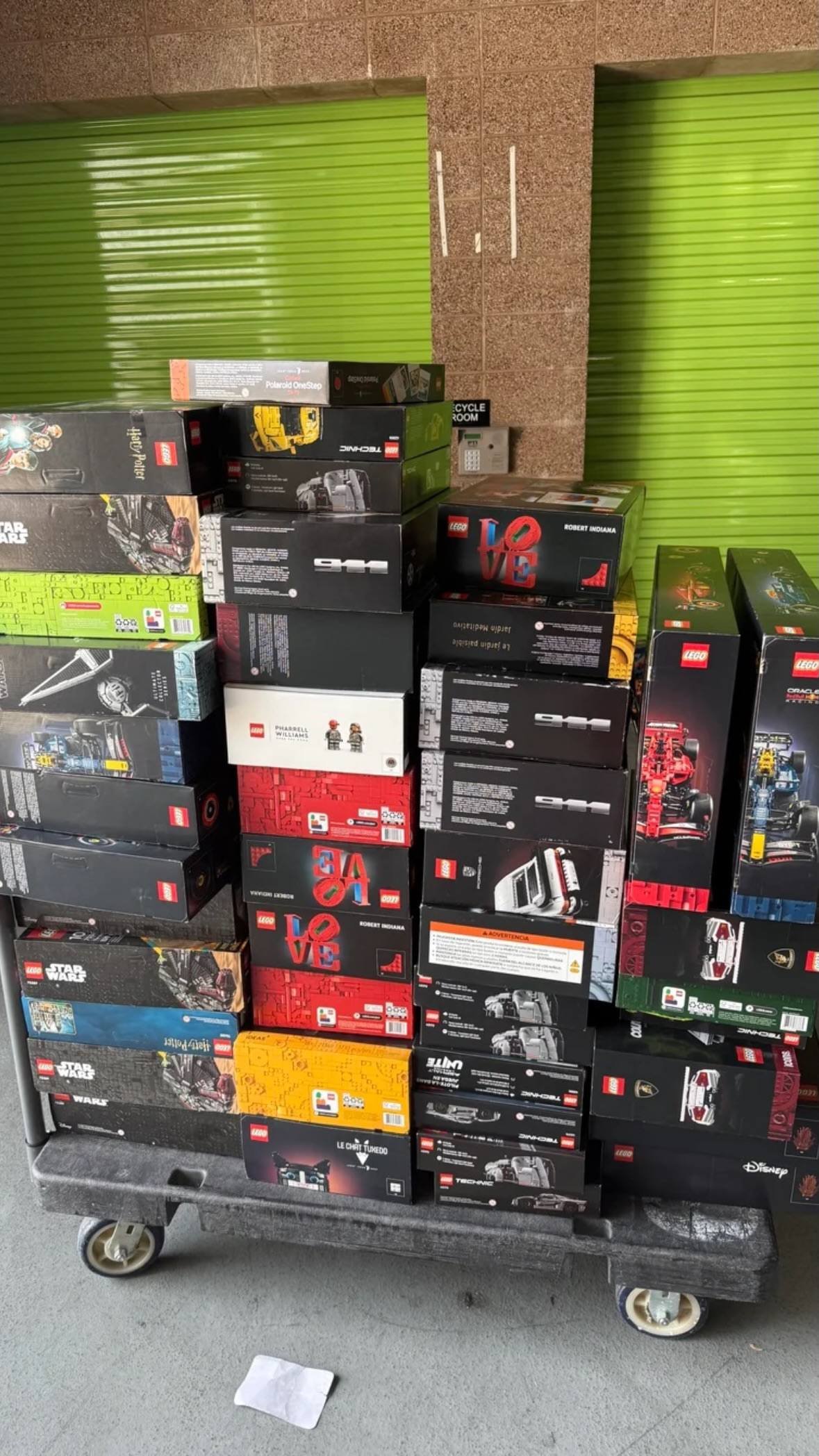 LEGO sets wholesale stock stacked on warehouse trolley for bulk resale